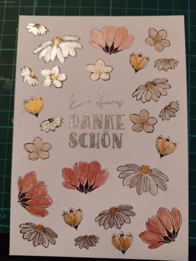 Dankeschönkarte Weiße Karte mit verschiedenen Blumen bestempelt, mit Glitzerfarbe koloriert und dem Text Ein kleines Dankeschön